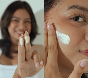Woman applying sunscreen using the two-finger rule.