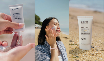 Woman applying SPF 50 sunscreen before outdoor activities under tropical sunlight